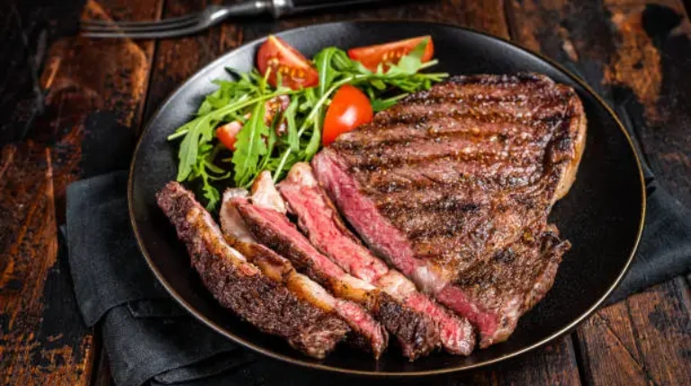 Delicious Eye of Round Steak: Easy Cooking Tips Eye of round steak is a favorite cut of meat. It can be tender and flavorful if cooked right. If you want to learn how to cook it, you're in the right spot. With the right methods, you can make a delicious, juicy steak that will wow everyone. Cooking eye of round steak is easy, whether you're experienced or new to cooking. Just follow some simple tips, and you'll have a juicy, flavorful steak. In this article, we'll show you how to cook eye of round steak perfectly. This way, you can enjoy a tasty and tender meal every time. Understanding Eye of Round Steak Steak lovers often explore different cuts, each with its own traits. The eye of round steak is a favorite for many. It's lean, making it great for those who want a tender eye of round steak with health benefits. Knowing how to cook an eye of round steak is key. Look for a steak that's red, has little marbling, and is the right thickness for your method. A good eye of round steak recipe will help you make a flavorful eye of round steak. Color: A nice red color means it's fresh and of high quality. Marbling: Less marbling is better, as it can make the steak tougher. Thickness: Pick a thickness that works for your cooking method, like grilling or pan-searing. Understanding the eye of round steak and choosing a quality cut will help you make a tasty flavorful eye of round steak. Whether you're a steak pro or new to it, the eye of round steak is worth trying. Essential Tools and Equipment for Perfect Results To cook eye of round steak perfectly, you need the right tools. A cast-iron skillet or Dutch oven is key. They help get a nice crust and even heat. A meat thermometer is also crucial. It makes sure your steak is cooked safely. With these tools, you're ready to cook a great eye of round steak. Other tools you might need include: A sharp knife for trimming and slicing the steak A cutting board for preparing the steak A pair of tongs or a spatula for handling the steak With these tools, cooking eye of round steak becomes easy. You'll get a delicious, tender steak. Whether you're looking for the best way to cook or a simple recipe, the right equipment is vital. Preparing Your Eye of Round Steak To make a delicious eye of round steak, you need to prepare it right. This means a few important steps to make it tender and flavorful. Learning how to prepare your steak is just as crucial as the cooking method. First, thaw your steak. You can thaw it in the fridge overnight or in cold water. After it's thawed, decide how you want to cook it. Whether you choose oven-roasting or stovetop, the prep is similar. Thawing and Trimming Thawing properly stops bacteria from growing. Then, trim off any extra fat. This makes sure your steak cooks evenly and tastes great, no matter how you cook it. Seasoning Seasoning lets you get creative with your steak. Use salt, pepper, and herbs and spices. The secret to a great steak is in how you prepare and cook it, so keep the seasoning simple. For a classic taste, try a marinade or rub before cooking. https://youtube.com/watch?v=iRD7z91eNn8 By following these steps, you're on your way to a tasty eye of round steak dish. Remember, the cooking method you choose will affect the final taste. So, pick wisely and enjoy learning to cook like a pro. How to Cook Eye of Round Steak To make a delicious eye of round steak, you need to know the basics of cooking it. You can cook it in a pan or in the oven. The secret to a juicy steak is to cook it just right, without overdoing it. It's important to keep the juices and flavors in when cooking a tender steak. Use a hot pan or oven to quickly sear the steak. Then, cook it at a lower temperature until it's done to your liking. Whether you like it rare, medium-rare, or well-done, the goal is the same: cook it to the perfect temperature. Here are some tips for cooking eye of round steak: Use a meat thermometer to check the steak's internal temperature Let the steak rest for a few minutes before slicing to keep the juices in Slice the steak against the grain for extra tenderness By following these tips, you can make a delicious, juicy, and tender eye of round steak. It will impress everyone. Always handle and store the steak safely to avoid foodborne illness. With practice, you'll get better at cooking eye of round steak to perfection. Mastering the Perfect Temperature Getting the perfect temperature is key when cooking eye of round steak. You want it to be safe to eat and still tender and flavorful. To cook eye of round steak right, use a thermometer to check the inside. A great easy eye of round steak recipe will tell you the right temperature. For medium-rare, it should be 130°F to 135°F. For medium, it's 140°F to 145°F. Letting the steak rest for a few minutes before slicing is also important. This makes it more tender and juicy. Use a meat thermometer to check the internal temperature of the steak. Let the steak rest for 5-10 minutes before slicing to allow the juices to redistribute. Use a cast-iron skillet or oven to cook the steak, as these methods allow for even heat distribution. By following these tips, you'll get a perfectly cooked eye of round steak every time. Always focus on temperature control and resting time for a delicious steak. Internal Temperature Guide Knowing the internal temperature guide is crucial for cooking eye of round steak. It shows how done the steak is, from rare to well-done. By following this guide, you can cook your steak just right. Resting Time Recommendations Resting the steak is often missed but it's very important. It lets the juices spread out and keeps the steak tender. By following the resting time, your steak will be juicy and full of flavor. Pan-Searing Techniques for Maximum Flavor To cook a delicious stovetop eye of round steak, you need to master pan-searing. This method cooks the steak quickly, keeping its juices and flavors inside. It's important to pick the right pan and oil for pan-searing. A hot skillet with a bit of oil is perfect for a nice crust on the steak. Here are some tips for pan-searing your eye of round steak: Use a hot skillet to achieve a nice crust on the steak Choose the right type of oil, such as olive or avocado oil, for added flavor Don't overcrowd the pan, cook the steak in batches if necessary Use a thermometer to ensure the steak is cooked to the desired temperature By following these tips, you'll cook a delicious eye of round steak on the stovetop. Remember, don't overcrowd the pan. Cook the steak in batches if you need to. With practice, you'll get better at pan-searing and make a tasty stovetop eye of round steak. Try different seasonings and marinades to add more flavor to your eye of round steak. Whether you're cooking a stovetop eye of round steak or a flavorful one, the secret to great flavor is using the right techniques and ingredients. Oven-Roasting Methods Oven-roasting is a great way to make a delicious eye of round steak. It cooks evenly and can make the steak tender. Remember, oven-roasting takes longer than other methods. To get a perfect oven-roasted eye of round steak, follow these steps: Preheat your oven to 325°F (160°C) for a tender steak. Use a meat thermometer to check the steak's internal temperature. Aim for 130-135°F (54-57°C) for medium-rare. Baste the steak with melted butter or oil to keep it moist and flavorful. By following these steps, you'll get a mouth-watering oven-roasted eye of round steak. It will be tender, juicy, and full of flavor. Oven-roasting is a great way to make a delicious and tender steak. Let the steak rest for 10-15 minutes before slicing to let the juices redistribute. Use a cast-iron skillet or oven-safe pan to cook the steak, as they hold heat well. Don't overcrowd the pan, as it can affect the steak's even cooking. With these tips, you'll be on your way to making a delicious oven-roasted eye of round steak. It's sure to please even the pickiest eaters. Marinades and Rubs for Enhanced Taste Marinades and rubs can make eye of round steak taste amazing. You can mix herbs and spices to create a flavorful eye of round steak. For an easy eye of round steak recipe, try olive oil, garlic, and your favorite seasonings in a marinade. To cook eye of round steak right, let it sit for a good while. This lets the flavors soak into the meat. You can pick from many marinades, like Italian or spicy Asian ones. Here are some marinade and rub ideas: Italian-style marinade with olive oil, garlic, and herbs Spicy Asian-inspired marinade with soy sauce, ginger, and chili flakes Cajun-style rub with paprika, cayenne pepper, and thyme The secret to a great marinade or rub is to let the steak sit long enough. This way, the flavors really get into the meat. With a bit of trying, you can make a flavorful eye of round steak that will wow everyone. Common Cooking Mistakes to Avoid Cooking eye of round steak can be tricky. To get a delicious eye of round steak, knowing common mistakes is key. Temperature control is especially important. It greatly affects the steak's tenderness and taste. Temperature Control Errors To cook eye of round steak the best way, keep a close eye on the temperature. Here are some tips to avoid temperature control errors: Use a meat thermometer to ensure the steak reaches a safe internal temperature. Avoid overcooking, as it can make the steak tough and dry. Let the steak rest for a few minutes before serving to allow the juices to redistribute. Cutting and Serving Mistakes When serving a tender eye of round steak, cutting it right is crucial. Here are some tips to avoid cutting and serving mistakes: Cut the steak against the grain to ensure tenderness. Use a sharp knife to prevent tearing the meat. Serve the steak immediately, as letting it sit for too long can cause it to dry out. Best Side Dishes to Serve Choosing the right side dishes is key when serving eye of round steak. It's not just about cooking the steak well. The right sides can make the meal even better. An easy eye of round steak recipe can be enhanced with the right sides. Pairing the steak with flavorful sides is essential. Start with vegetables that complement the steak's taste. Options include roasted Brussels sprouts, sautéed mushrooms, or grilled asparagus. These add a nice contrast in texture and flavor. Vegetable Pairings Roasted Brussels sprouts with a drizzle of balsamic glaze Sautéed mushrooms with garlic and herbs Grilled asparagus with a squeeze of lemon juice Starch Accompaniments For starch sides, classic choices like mashed potatoes or roasted sweet potatoes are great. They're delicious and soak up the steak's juices. The right sides make the meal complete, highlighting the steak. With these side dish ideas, you're set for a memorable meal. Whether it's a special occasion or a weeknight dinner, the right sides can elevate your eye of round steak. Storage and Leftover Tips Mastering how to cook eye of round steak is just the start. Proper storage and reheating are key to keeping your dish safe and tasty. Wrap your delicious eye of round steak tightly in plastic or foil. Then, refrigerate it within two hours of cooking. To reheat your tender eye of round steak, use a low heat. This prevents it from drying out. You can reheat it in the oven or on the stovetop. Here are some tips: Reheat the steak to at least 165°F (74°C) for food safety. Use a meat thermometer to check the internal temperature, especially when reheating. Avoid overcooking the steak, as it can become tough and dry. By following these tips, you can enjoy your delicious eye of round steak for days. Always prioritize food safety when handling and storing leftovers. With proper care, your tender eye of round steak will stay flavorful and tender. Conclusion Cooking the perfect eye of round steak is within reach with the right steps. You've learned about its unique qualities and how to use the best tools. Now, you can make juicy, tender, and flavorful eye of round steak dishes at home. Start with top-quality eye of round steak and prepare it well. Season it right and cook it to the perfect temperature. Soon, you'll be a pro at how to cook eye of round steak and make dishes that taste like they're from a restaurant. Don't hesitate to try new things with these easy eye of round steak recipe tips. Show off your best way to cook eye of round steak skills to your loved ones. Enjoy the joy of making tasty, homemade meals for everyone. FAQ What makes eye of round steak unique? Eye of round steak is special because it comes from the cow's hindquarters. It's lean and tender. Plus, it's full of nutrients, making it great for those who care about their health. What are the quality indicators to look for when buying eye of round steak? Look for a nice red color and minimal marbling when buying eye of round steak. Also, check the thickness to match your cooking method. These signs show the steak's quality and tenderness. What are the essential tools and equipment needed for cooking eye of round steak? You'll need a cast-iron skillet for pan-searing and a Dutch oven for oven roasting. A meat thermometer is also key to ensure the steak is cooked just right. How do I properly thaw and prepare an eye of round steak? Start by thawing the steak properly to avoid bacterial growth. Then, trim any excess fat and tenderize it for even cooking. Season it simply with salt, pepper, and herbs for the best taste. What is the ideal internal temperature for a perfectly cooked eye of round steak? For medium-rare, aim for 130°F to 135°F. Medium is 140°F to 145°F. Let the steak rest for a few minutes before slicing. This makes it tender and flavorful. How do I achieve a nice crust on my eye of round steak using the pan-searing method? Use a hot cast-iron skillet and the right oil for a nice crust. Cook in batches if needed to avoid overcrowding. This method cooks the steak quickly, keeping it juicy and flavorful. What are the key steps for oven-roasting an eye of round steak? Use the right temperature and timing for oven-roasting. Baste the steak to keep it moist and add flavor. Oven-roasting takes longer but results in a tender, juicy steak. What are some common cooking mistakes to avoid when preparing eye of round steak? Avoid incorrect temperature control and cutting the steak wrong. These mistakes can make the steak tough or dry. Knowing these can help you cook it perfectly. What are some best side dishes to serve with eye of round steak? Great side dishes include roasted Brussels sprouts, sautéed mushrooms, mashed potatoes, and roasted sweet potatoes. They complement the steak's flavors, making the meal satisfying. How do I properly store and reheat leftover eye of round steak? Wrap leftover steak tightly in plastic wrap or foil and refrigerate within two hours. Reheat at a low temperature to prevent drying out. This way, you can enjoy it for days.